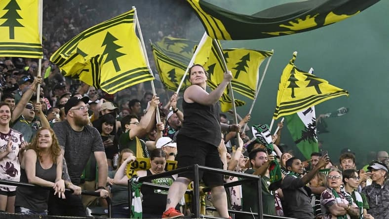 Jul 23, 2022; Portland, Oregon, USA; Portland Timbers fans celebrate the scoring of a goal during the second half against the San Jose Earthquakes at Providence Park. The Timbers won the game 2-1. Mandatory Credit: Troy Wayrynen-USA TODAY Sports