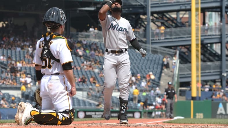 Jul 24, 2022; Pittsburgh, Pennsylvania, USA; Miami Marlins right fielder Bryan De La Cruz (14) crosses home plate on a solo home run against the Pittsburgh Pirates during the fifth inning at PNC Park. Mandatory Credit: Charles LeClaire-USA TODAY Sports