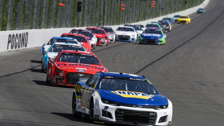Jul 24, 2022; Long Pond, Pennsylvania, USA; NASCAR Cup Series driver Chase Elliott (9) leads a pack of cars during the M&M S Fan Appreciation 400 at Pocono Raceway. Mandatory Credit: Matthew OHaren-USA TODAY Sports