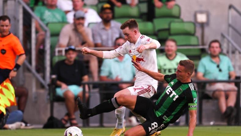 Austin FC midfielder Alex Ring (8) dives to block New York Red Bulls forward Cameron Harper (17) during the match at Q2 Stadium in Austin, Texas on July 24, 2022.

Aem Austin Fc Vs Ny Red Bulls 4