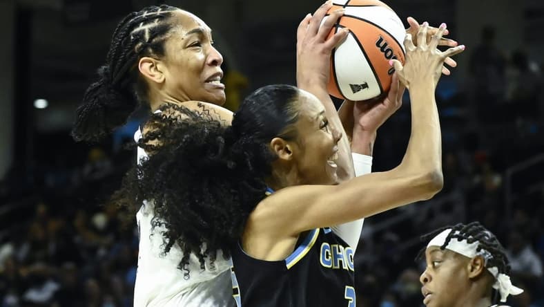 Jul 26, 2022; Chicago, IL, USA;  Las Vegas Aces forward A'ja Wilson (22), left, fights for the ball against Chicago Sky guard Rebekah Gardner (35) during the first half of the Commissioners Cup-Championships at Wintrust Arena. Mandatory Credit: Matt Marton-USA TODAY Sports