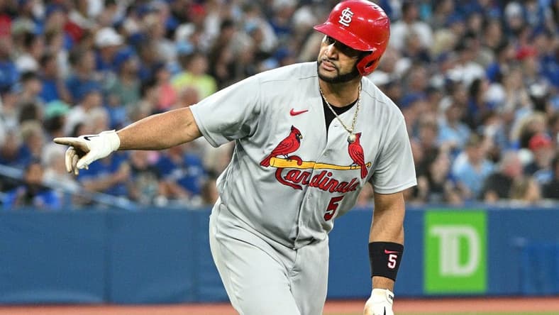 Jul 27, 2022; Toronto, Ontario, CAN;  St. Louis Cardinals first baseman Albert Pujols (5) reacts after hitting a three run home run against the Toronto Blue Jays in the fifth inning at Rogers Centre. Mandatory Credit: Dan Hamilton-USA TODAY Sports
