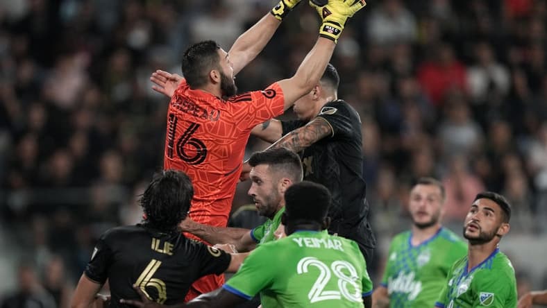 Jul 29, 2022; Los Angeles, California, USA; LAFC goalkeeper Maxime Crepeau (16) makes a save against the Seattle Sounders in the first half at Banc of California Stadium. Mandatory Credit: Kirby Lee-USA TODAY Sports
