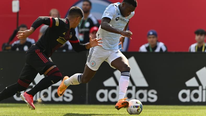 Jul 30, 2022; Chicago, Illinois, USA; Chicago Fire FC forward Jhon Duran (26) controls the ball as Atlanta United FC defender Alan Franco (6) defends in the first half at Soldier Field. Mandatory Credit: Jamie Sabau-USA TODAY Sports