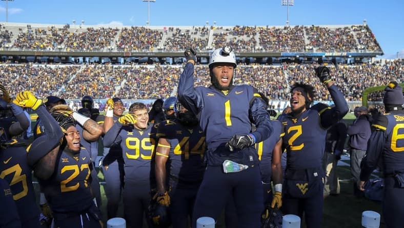 Nov 10, 2018; Morgantown, WV, USA; West Virginia Mountaineers cornerback Derrek Pitts Jr. (1) celebrates after a turnover during the fourth quarter against the TCU Horned Frogs at Mountaineer Field at Milan Puskar Stadium. Mandatory Credit: Ben Queen-USA TODAY Sports