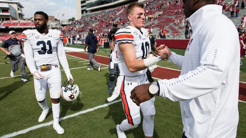 Auburn quarterback Bo Nix (10) shakes hands with Auburn athletics director Allen Greene at Donald W. Reynolds Razorback Stadium in Fayetteville, Ark., on Saturday, Oct. 19, 2019. Auburn defeated Arkansas 51-10.

Jc Auburnark 63