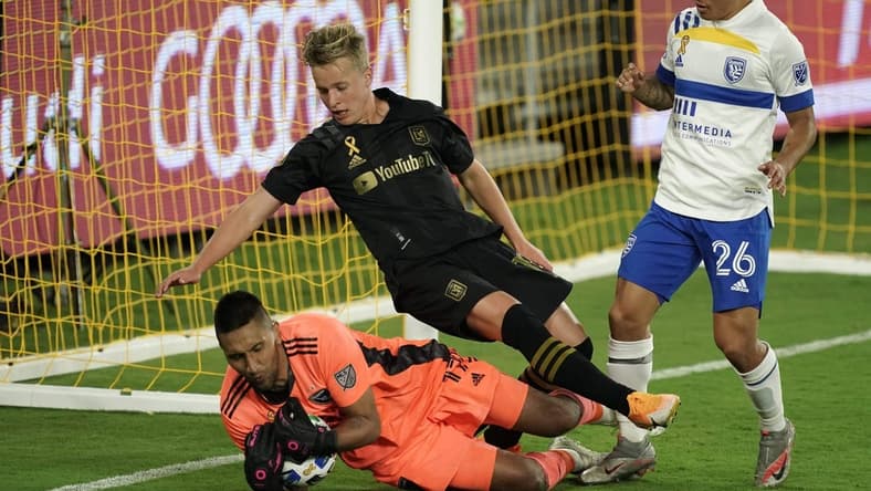 Sep 2, 2020; Los Angeles, CA, Los Angeles, CA, USA; LAFC forward Danny Musovski (16) collides with San Jose Earthquakes goalkeeper Daniel Vega (17) in the second half at Banc of California Stadium . LAFC defeated the Earthquakes 5-1. Mandatory Credit: Kirby Lee-USA TODAY Sports