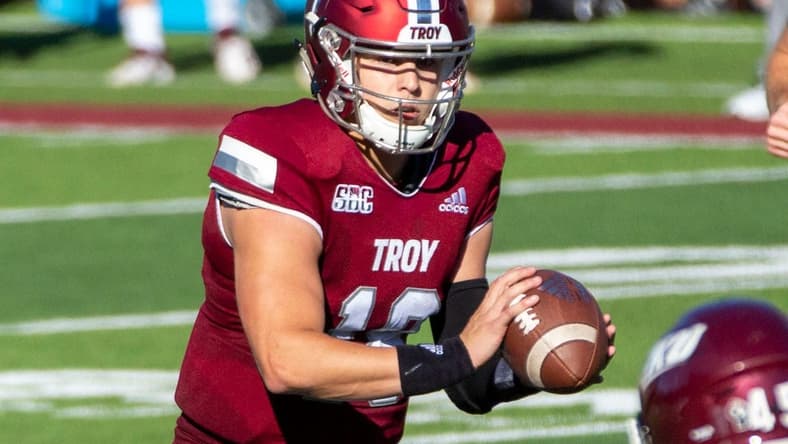 Troy University quarterback Gunnar Watson (18) grasps the ball after the snap.

Troy Vs Eastern Kentucky