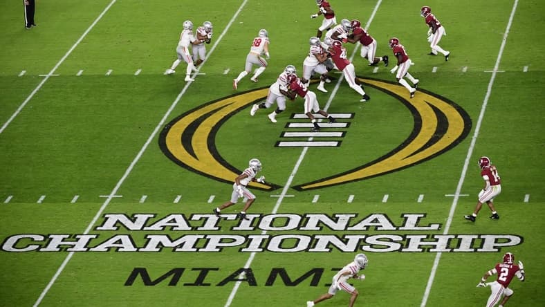Jan 11, 2021; Miami Gardens, FL, USA; General view as quarterback Justin Fields (1) hands off to running back Master Teague III (33) against the Alabama Crimson Tide in the second quarter in the 2021 College Football Playoff National Championship Game at Hard Rock Stadium. Mandatory Credit: Douglas DeFelice-USA TODAY Sports
