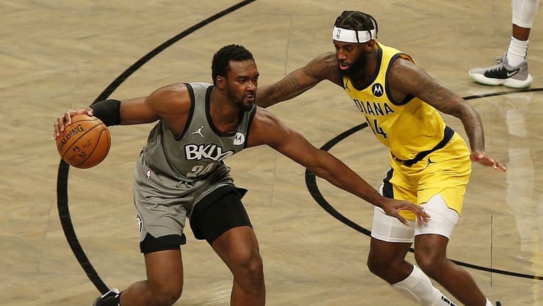 Feb 10, 2021; Brooklyn, New York, USA; Brooklyn Nets guard Noah Vonleh (24) dribbles against Indiana Pacers forward JaKarr Sampson (14) during the second half at Barclays Center. Mandatory Credit: Andy Marlin-USA TODAY Sports