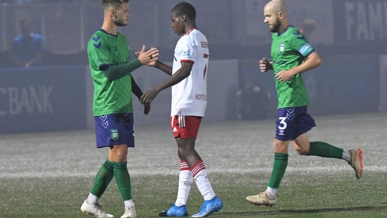 Greenville Triumph midfielder Max Hemmings(5) and North Texas SC midfielder Bernard Kamungo(7) shake hands after Greenville won 4-0 at Legacy Early College Stadium in Greenville, S.C. Saturday, May 1, 2021.

Greenville Triumph Vs North Texas Sc May 1 2021