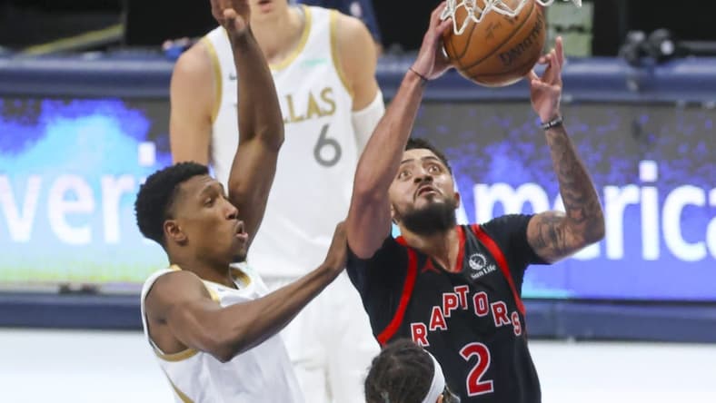 May 14, 2021; Dallas, Texas, USA; Toronto Raptors guard Jalen Harris (2) dribbles the ball past Dallas Mavericks guard Josh Richardson (0) during the third quarter at American Airlines Center. Mandatory Credit: Kevin Jairaj-USA TODAY Sports
