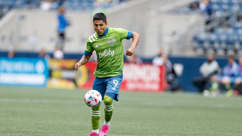 May 23, 2021; Seattle, Washington, USA; Seattle Sounders FC forward Raul Ruidiaz (9) dribbles the ball against the Atlanta United FC during the first half at Lumen Field. Mandatory Credit: Jennifer Buchanan-USA TODAY Sports