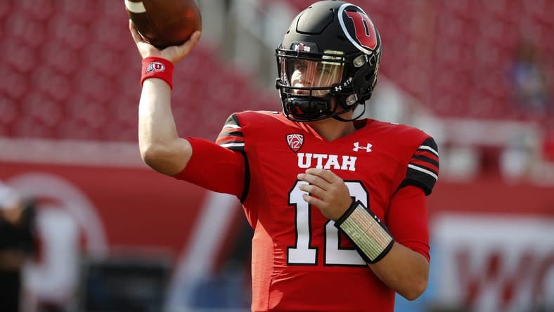 Sep 2, 2021; Salt Lake City, Utah, USA; Utah Utes quarterback Charlie Brewer (12) warm up prior to their game against the Weber State Wildcats  at Rice-Eccles Stadium. Mandatory Credit: Jeffrey Swinger-USA TODAY Sports