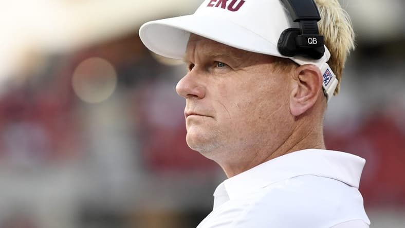 Sep 11, 2021; Louisville, Kentucky, USA; Eastern Kentucky Colonels head coach Walt Wells watches from the sideline during the first quarter against the Louisville Cardinals at Cardinal Stadium. Mandatory Credit: Jamie Rhodes-USA TODAY Sports