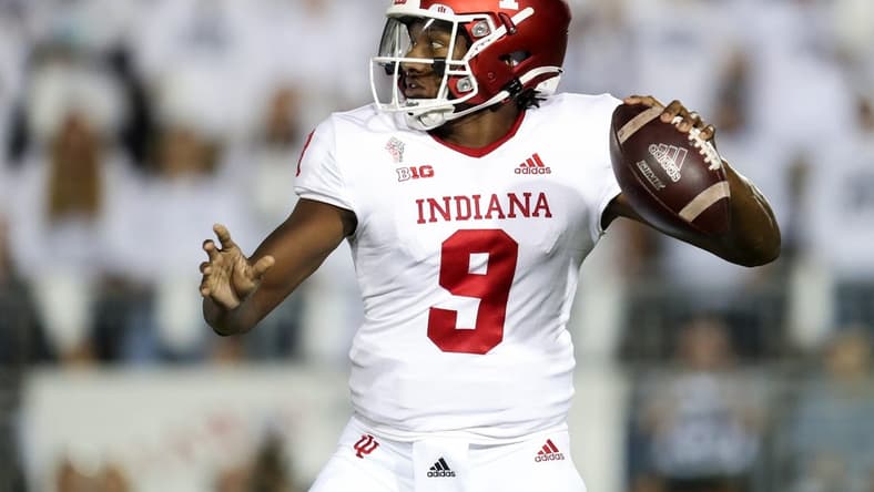 Oct 2, 2021; University Park, Pennsylvania, USA; Indiana Hoosiers quarterback Michael Penix Jr. (9) drops back to throw a pass against the Penn State Nittany Lions during the first quarter at Beaver Stadium. Mandatory Credit: Matthew OHaren-USA TODAY Sports