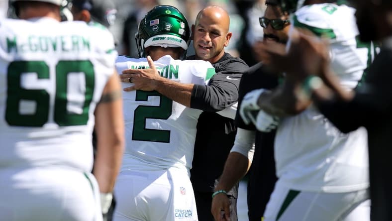 Oct 3, 2021; East Rutherford, NJ, USA; New York Jets head coach Robert Saleh hugs quarterback Zach Wilson before the game against the Tennessee Titans at MetLife Stadium. Mandatory Credit: Kevin R. Wexler-USA TODAY Sports