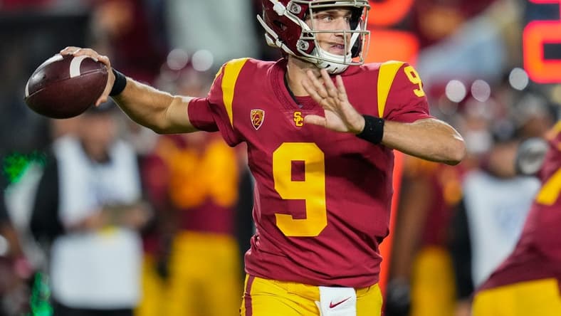 Oct 9, 2021; Los Angeles, California, USA; USC Trojans quarterback Kedon Slovis (9) throws a pass during the third quarter against the Utah Utes at United Airlines Field at Los Angeles Memorial Coliseum. Mandatory Credit: Robert Hanashiro-USA TODAY Sports