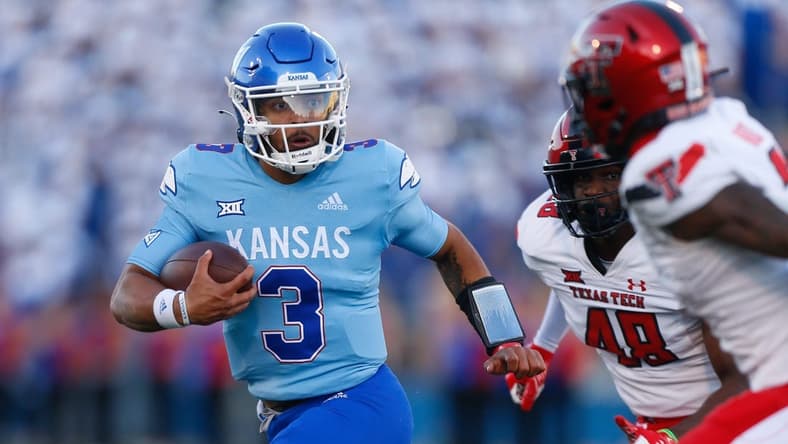 Kansas redshirt senior quarterback Miles Kendrick (3) runs for yards during the second half of Saturday, Oct. 16, 2021 game against Texas Tech at David Booth Kansas Memorial Stadium. The Jayhawks lost 41-14.