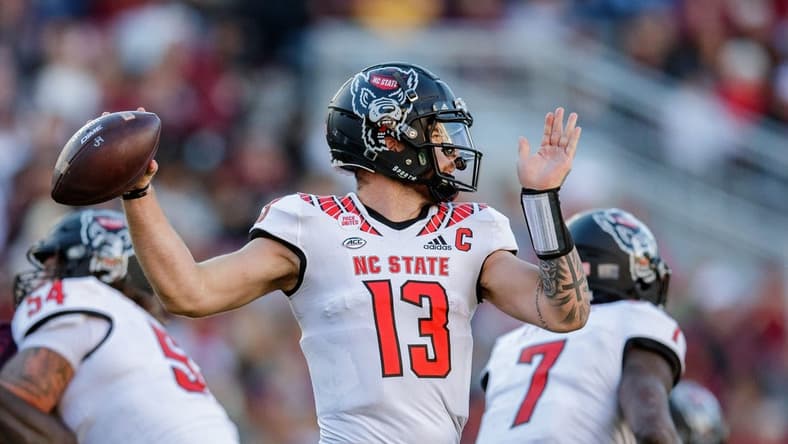 North Carolina State Wolfpack quarterback Devin Leary (13) passes to a teammate. The North Carolina State Wolfpack lead the Florida State Seminoles 14-0 at the half Saturday, Nov. 6, 2021.

Fsu V Nc State622