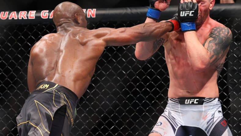 Nov 6, 2021; New York, NY, USA; Kamaru Usman (red gloves) competes against Colby Covington (blue gloves) during UFC 268 at Madison Square Garden. Mandatory Credit: Ed Mulholland-USA TODAY Sports