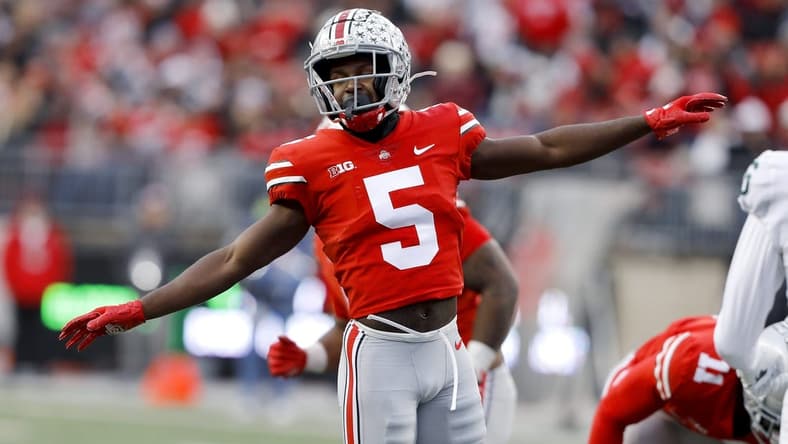 Nov 20, 2021; Columbus, Ohio, USA; Ohio State Buckeyes cornerback Marcus Williamson (5) celebrates the pass break up on third down during the second half against the Michigan State Spartans at Ohio Stadium. Mandatory Credit: Joseph Maiorana-USA TODAY Sports