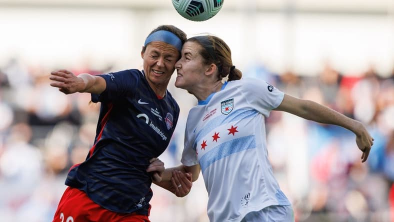 Nov 20, 2021; Louisville, Kentucky, USA; Washington Spirit forward Ashley Hatch (33) heads the ball against Chicago Red Stars defender Casey Krueger (6) during the NWSL Championship match at Lynn Family Stadium. Mandatory Credit: Jordan Prather-USA TODAY Sports