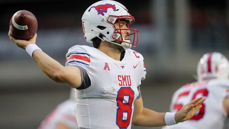 Nov 20, 2021; Cincinnati, Ohio, USA; Southern Methodist Mustangs quarterback Tanner Mordecai (8) throws a pass against the Cincinnati Bearcats in the first half at Nippert Stadium. Mandatory Credit: Katie Stratman-USA TODAY Sports