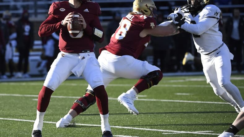 Nov 27, 2021; Chestnut Hill, Massachusetts, USA;  Boston College Eagles quarterback Phil Jurkovec (5) looks for an open receiver during the second half against the Wake Forest Demon Deacons at Alumni Stadium. Mandatory Credit: Bob DeChiara-USA TODAY Sports
