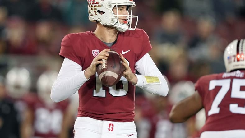 Nov 27, 2021; Stanford, California, USA; Stanford Cardinal quarterback Tanner McKee (18) drops back to pass during the first quarter against the Notre Dame Fighting Irish at Stanford Stadium. Mandatory Credit: Darren Yamashita-USA TODAY Sports