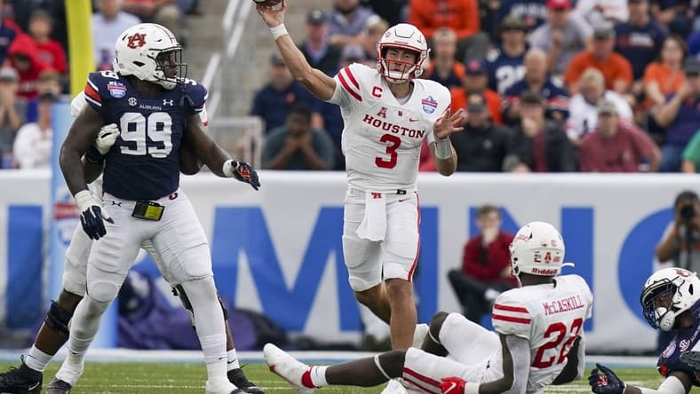 Dec 28, 2021; Birmingham, Alabama, USA; Houston Cougars quarterback Clayton Tune (3) passes against the Auburn Tigers during the second half of the 2021 Birmingham Bowl at Protective Stadium. Mandatory Credit: Marvin Gentry-USA TODAY Sports