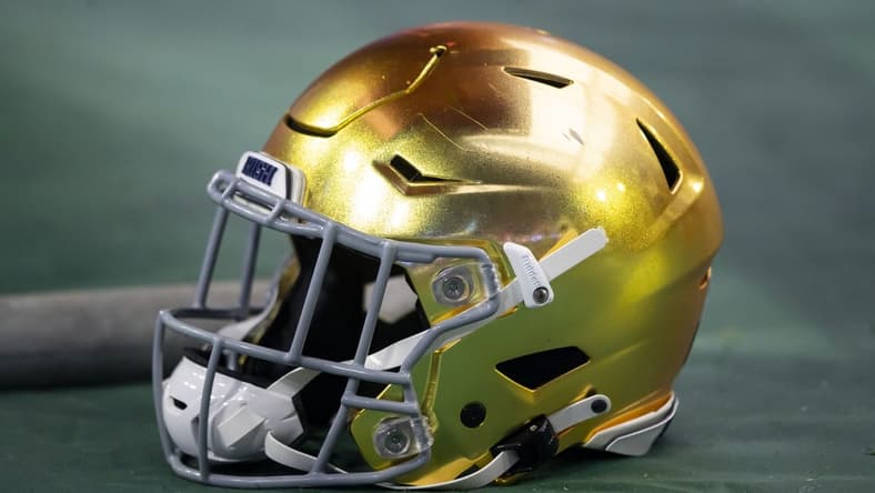 Jan 1, 2022; Glendale, Arizona, USA; Detailed view of a gold Notre Dame Fighting Irish helmet during the 2022 Fiesta Bowl at State Farm Stadium. Mandatory Credit: Mark J. Rebilas-USA TODAY Sports
