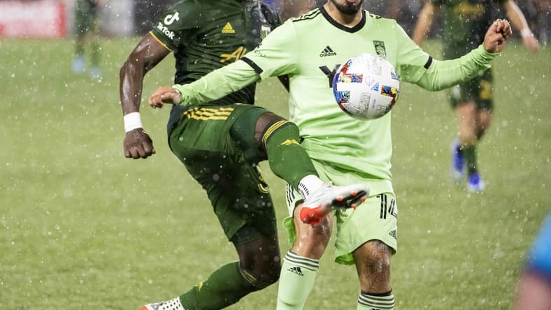 Mar 12, 2022; Portland, Oregon, USA; Portland Timbers midfielder Santiago Moreno (30) attacks Austin FC forward Diego Fag  ndez (14) during the second half at Providence Park. The Timbers won the game 1-0. Mandatory Credit: Troy Wayrynen-USA TODAY Sports