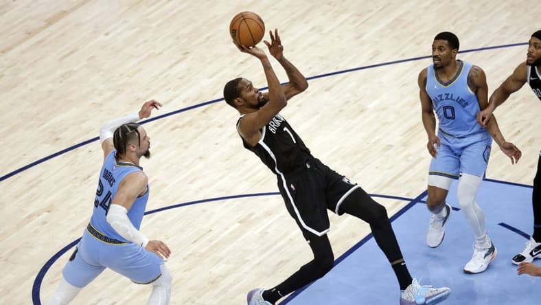 Mar 23, 2022; Memphis, Tennessee, USA; Brooklyn Nets forward Kevin Durant (7) shoots during the second half against the Memphis Grizzlies at FedExForum. Mandatory Credit: Petre Thomas-USA TODAY Sports
