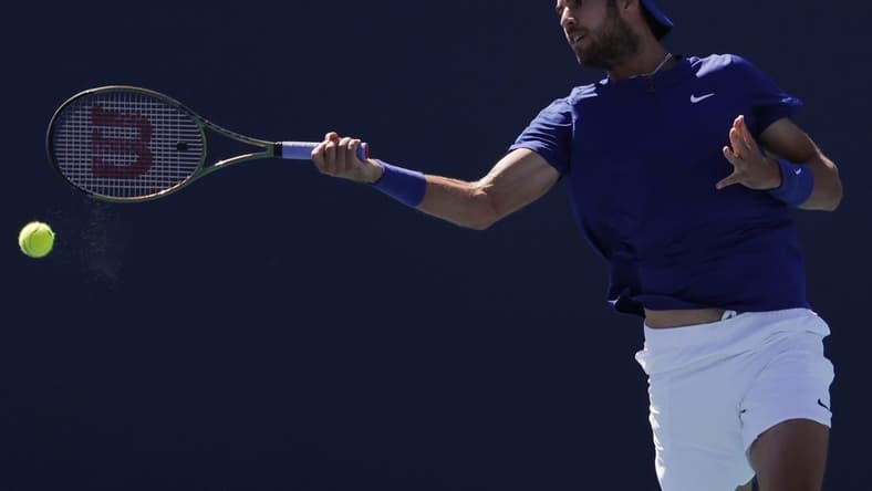Mar 26, 2022; Miami Gardens, FL, USA; Karen Khachanov  hits a forehand against Tommy Paul (USA) (not pictured) in a second round men's singles match in the Miami Open at Hard Rock Stadium. Mandatory Credit: Geoff Burke-USA TODAY Sports