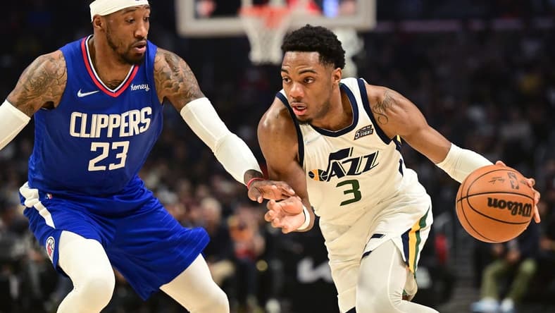 Mar 29, 2022; Los Angeles, California, USA;   Utah Jazz guard Trent Forrest (3) is defended by Los Angeles Clippers forward Robert Covington (23) as he drives to the basket in the first half of the game at Crypto.com Arena. Mandatory Credit: Jayne Kamin-Oncea-USA TODAY Sports