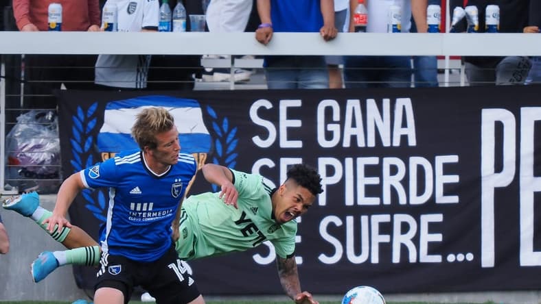 Apr 2, 2022; San Jose, California, USA; San Jose Earthquakes midfielder Jackson Yueill (14) fouls Austin FC midfielder Daniel Pereira (6) for penalty kick during the second half at PayPal Park. Mandatory Credit: Kelley L Cox-USA TODAY Sports