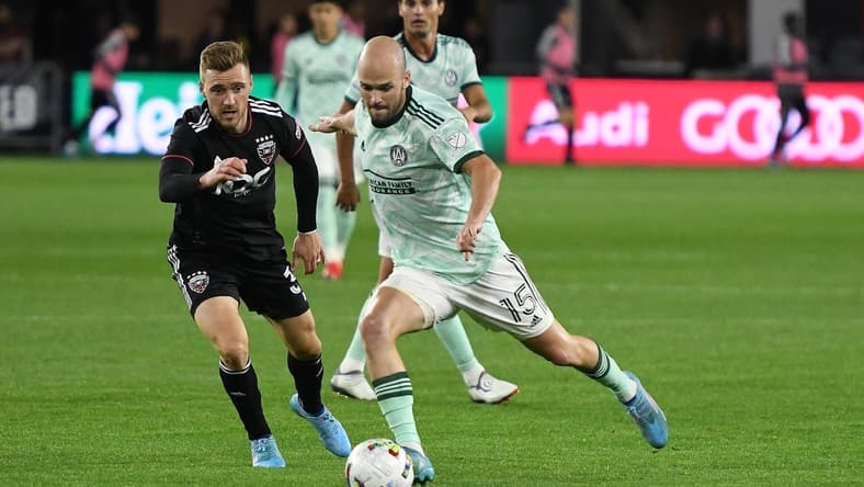 Apr 2, 2022; Washington, District of Columbia, USA;  Atlanta United defender Andrew Gutman (15) takes a shot by D.C. United defender Julian Gressel (31) in the second half at Audi Field. Mandatory Credit: Mitchell Layton-USA TODAY Sports