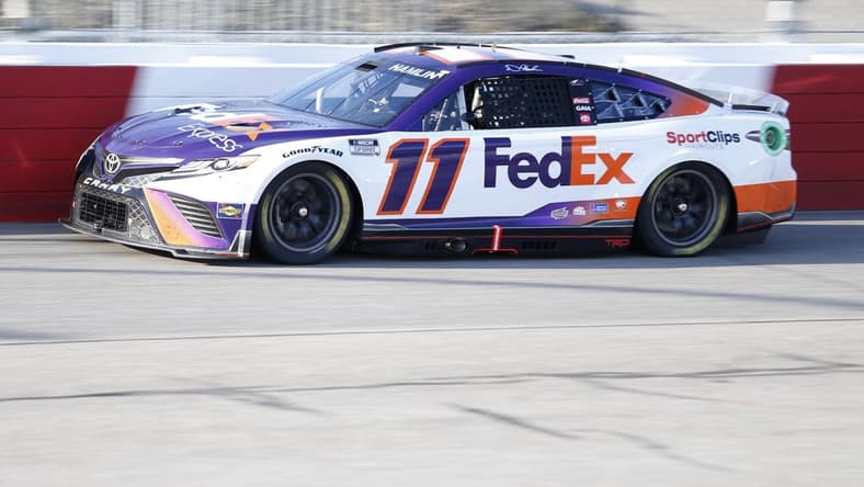 Apr 3, 2022; Richmond, Virginia, USA; NASCAR Cup Series driver Denny Hamlin (11) races during the Toyota Owners 400 at Richmond International Raceway. Mandatory Credit: Amber Searls-USA TODAY Sports