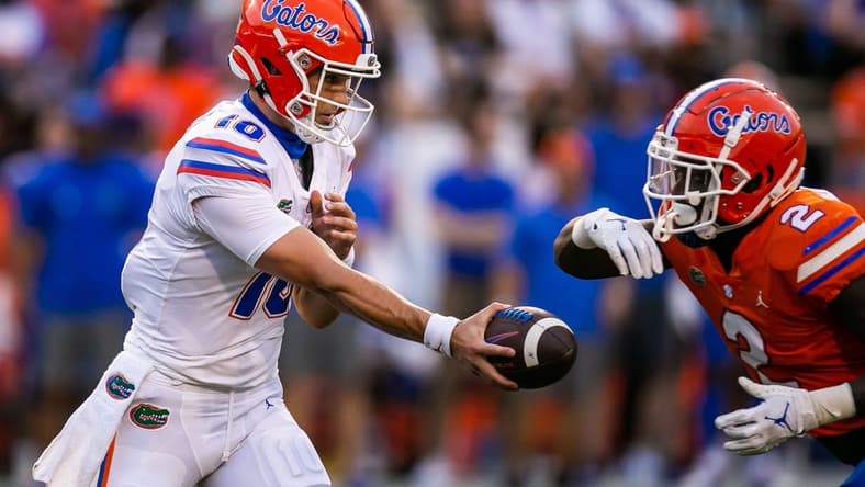 Florida Gators quarterback Jack Miller III (10) hands off to Florida Gators running back Montrell Johnson (2) in the first quarter. The Florida Gators scrimmaged in the first quarter during the annual Orange and Blue spring game at Ben Hill Griffin Stadium in Gainesville, FL, Thursday afternoon, April 14, 2022. [Doug Engle/Ocala Star Banner]2022

Oca Orangeandbluegame