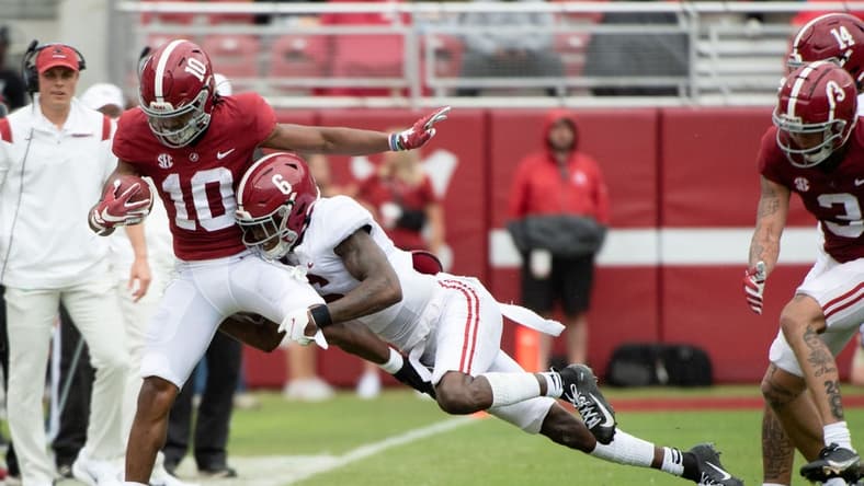 Apr 16, 2022; Tuscaloosa, Alabama, USA; Crimson wide receiver JoJo Earle (10) is driven out of bounds by White defensive back Khyree Jackson (6) during the A-Day game at Bryant-Denny Stadium. Mandatory Credit: Gary Cosby Jr.-USA TODAY Sports
