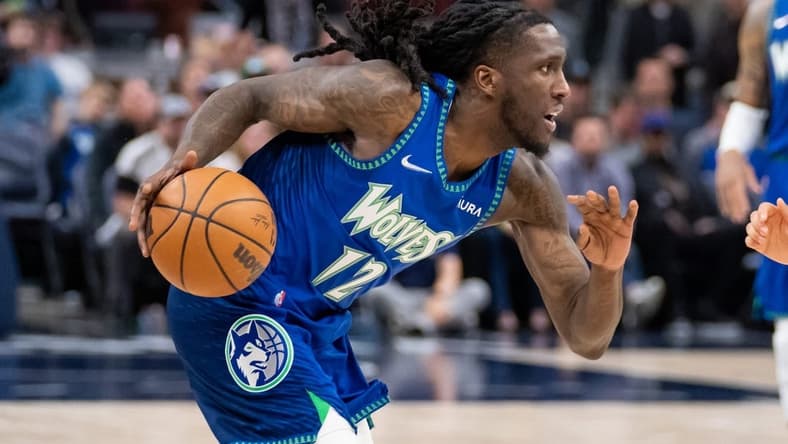 Apr 21, 2022; Minneapolis, Minnesota, USA; Minnesota Timberwolves forward Taurean Prince (12) dribbles against the Memphis Grizzlies in the thirdn quarter during game one of the three round for the 2022 NBA playoffs at Target Center. Mandatory Credit: Brad Rempel-USA TODAY Sports