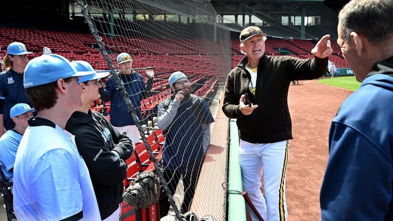 The Medfield baseball team listens to legendary Red Sox pitcher Bill "The Spaceman" Lee before the Fenway Park matchup against Hopkinton,  April 29, 2022. Lee, 75, was in the uniform for his Savannah Bananas travel team.

9543113002p Bos Fenway