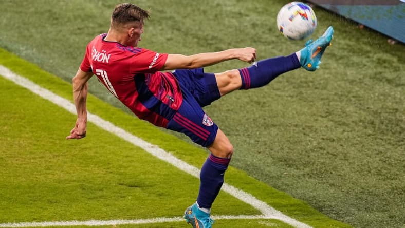 May 10, 2022; Kansas City, Kansas, USA; FC Dallas forward Szabolcs Schon (11) clears the ball during the second half against Sporting Kansas City at Children's Mercy Park. Mandatory Credit: Jay Biggerstaff-USA TODAY Sports