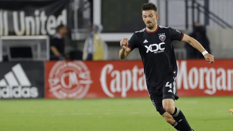 May 18, 2022; Washington, District of Columbia, USA; D.C. United defender Brendan Hines-Ike (4) dribbles the ball against New York City FC at Audi Field. Mandatory Credit: Geoff Burke-USA TODAY Sports