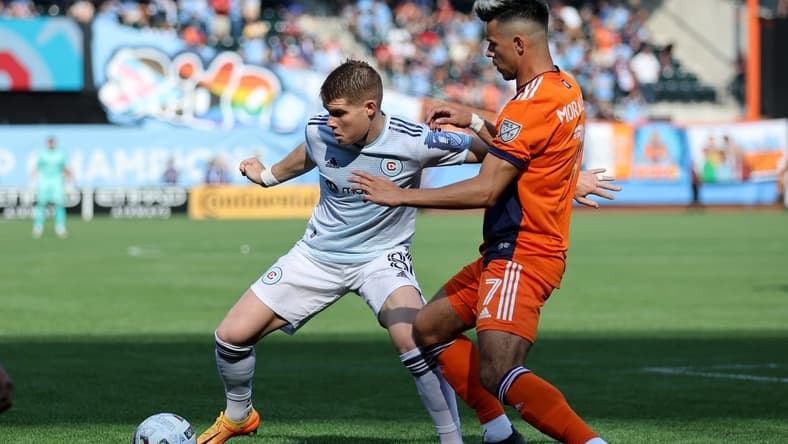 May 22, 2022; New York, NY, New York, NY, USA; Chicago Fire forward Chris Mueller (8) controls the ball against New York City FC midfielder Alfredo Morales (7) during the first half at Citi Field. Mandatory Credit: Brad Penner-USA TODAY Sports