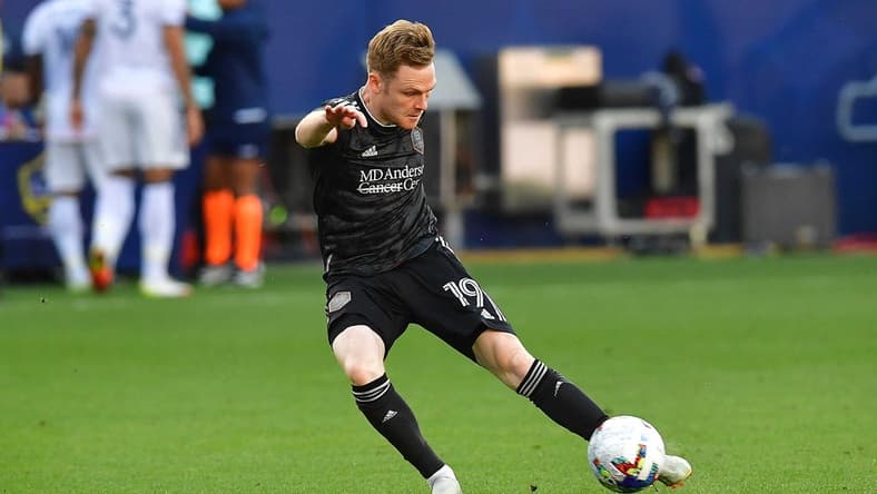 May 22, 2022; Carson, California, USA; Houston Dynamo forward Tyler Pasher (19) scores a goal against the Los Angeles Galaxy during the second half at Dignity Health Sports Park. Mandatory Credit: Gary A. Vasquez-USA TODAY Sports