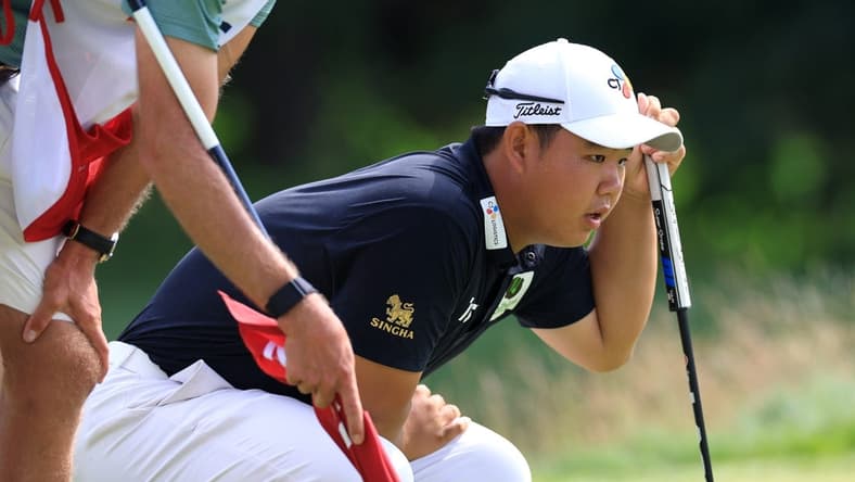Jun 17, 2022; Brookline, Massachusetts, USA; Joohyung Kim lines up a putt during the second round of the U.S. Open golf tournament. Mandatory Credit: Aaron Doster-USA TODAY Sports