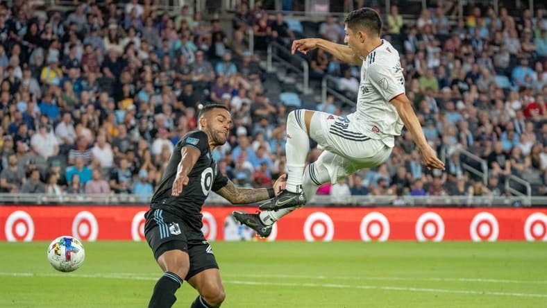 Jul 3, 2022; Saint Paul, Minnesota, USA; Real Salt Lake forward Jefferson Savarino (11) shoots, defended by Minnesota United defender D.J. Taylor (27) in the second half at Allianz Field. Mandatory Credit: Matt Blewett-USA TODAY Sports