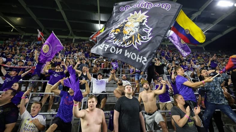 Jul 9, 2022; Orlando, Florida, USA; Fans celebrate after Orlando City beats Inter Miami at Exploria Stadium. Mandatory Credit: Nathan Ray Seebeck-USA TODAY Sports
